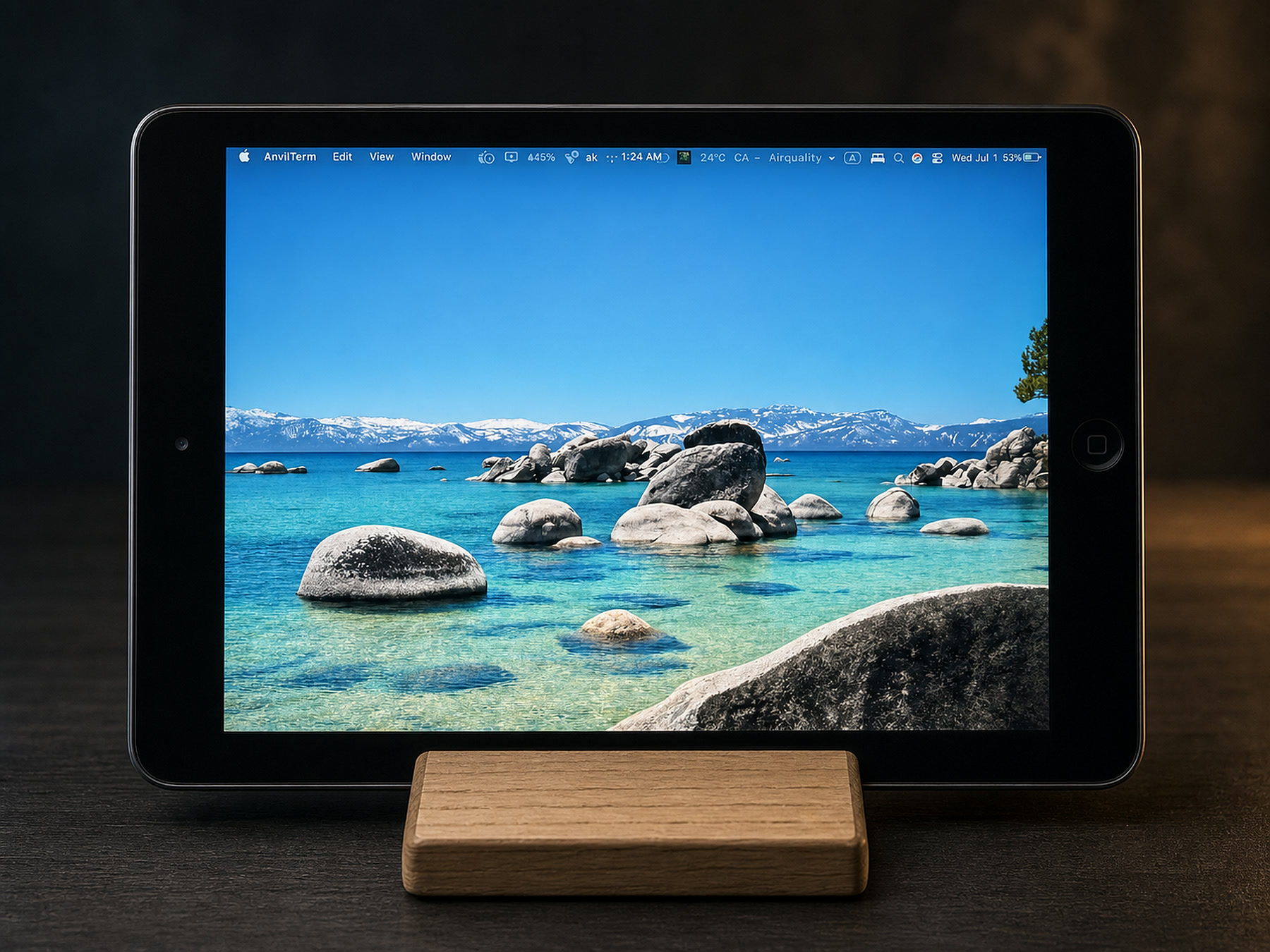 A 2012 iPad mini running a macOS desktop as a second display via AnvilDesk